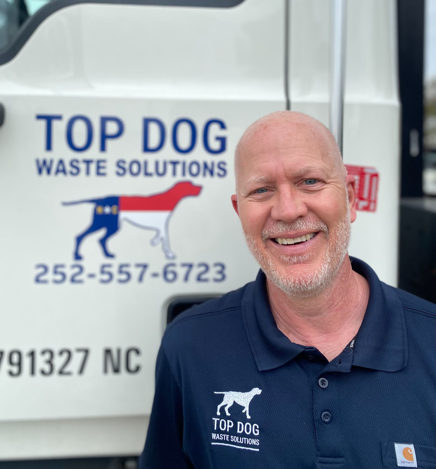 Crew from Top Dog Waste Solutions preparing the truck to remove trash at a commercial property